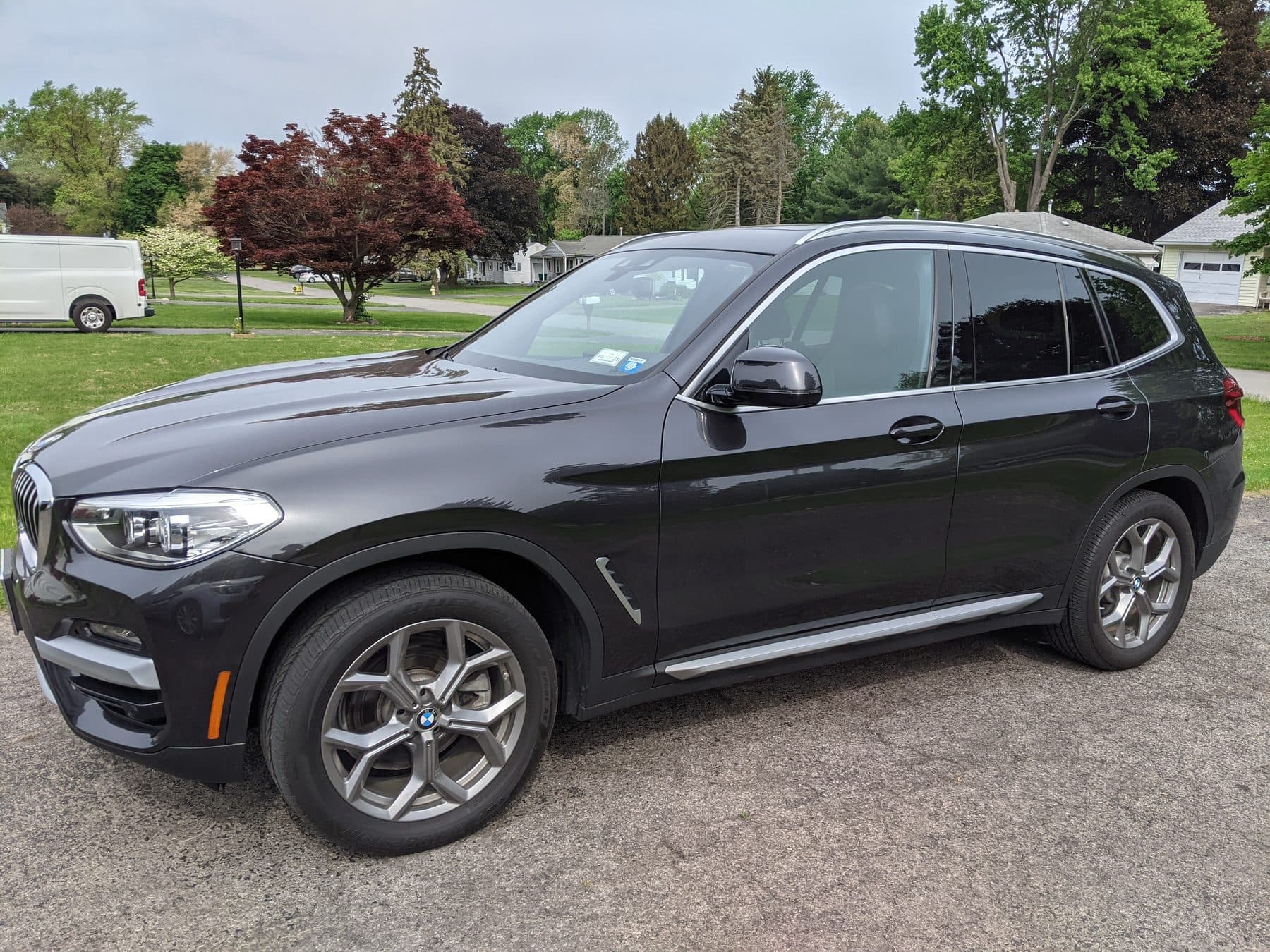 Dark BMW X3 clean in a driveway