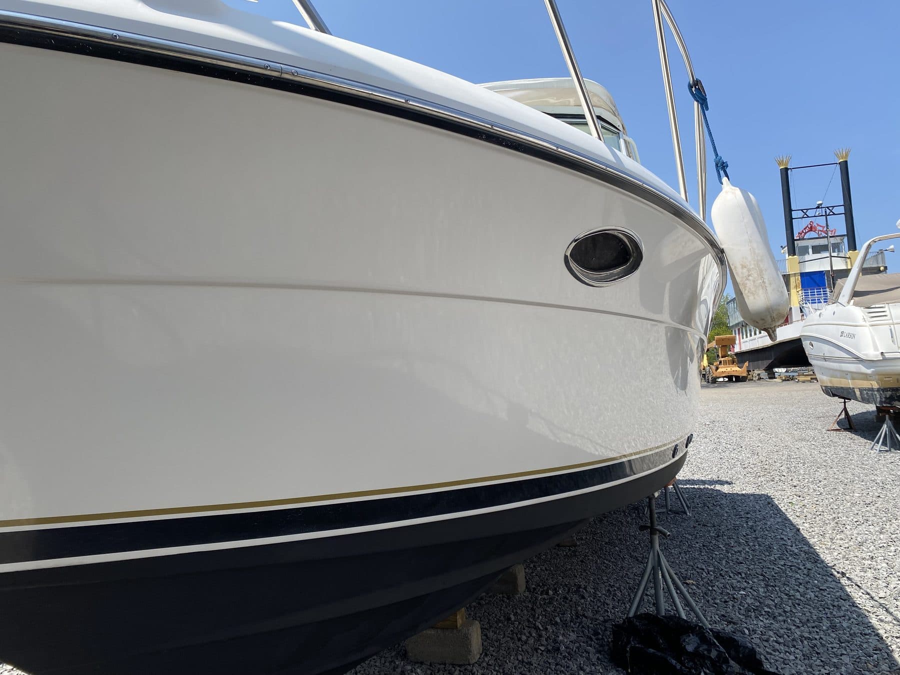 White boat hull clean and glossy in a boatyard