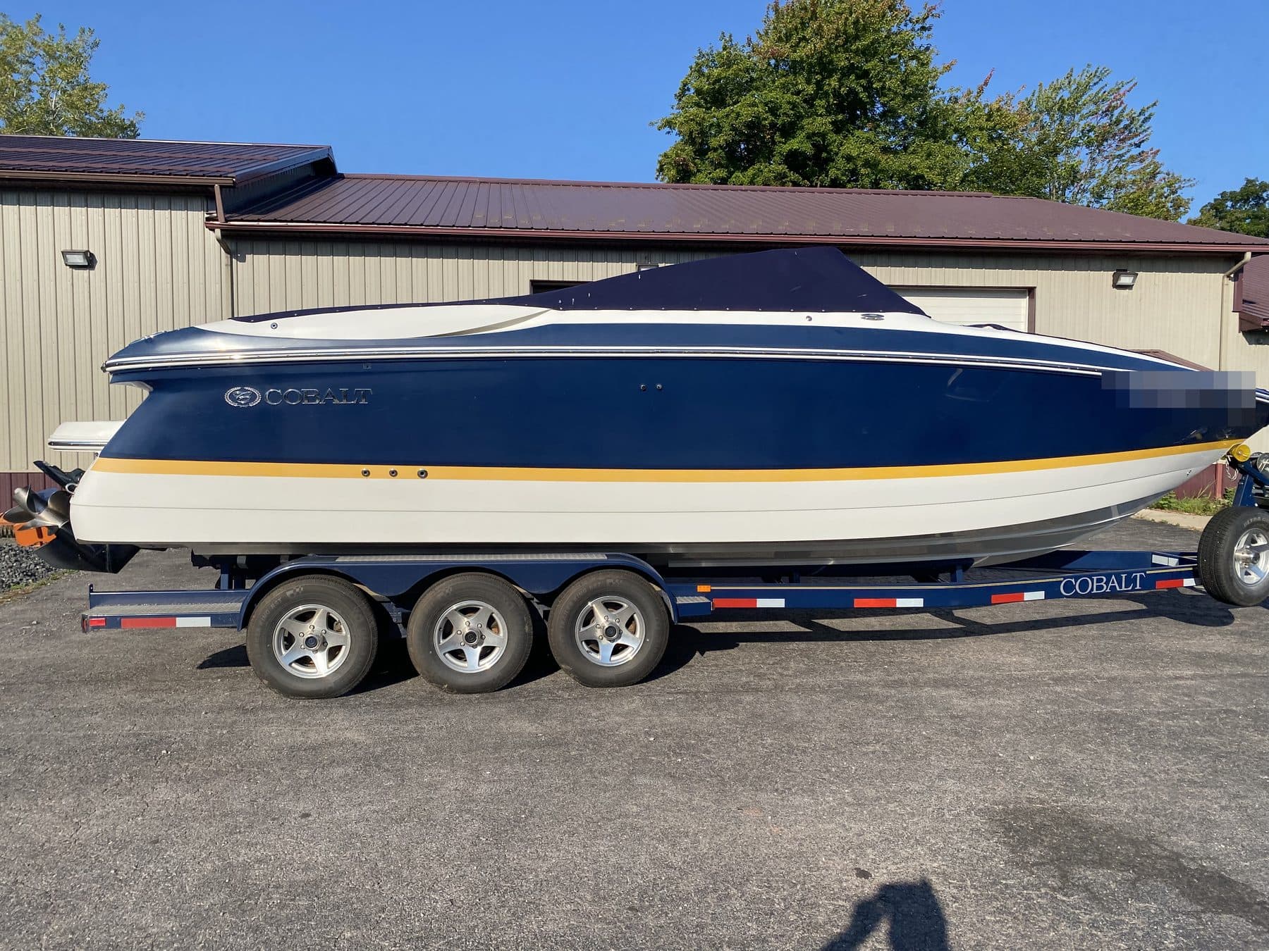 Blue Cobalt on its trailer, gelcoat flat and dull