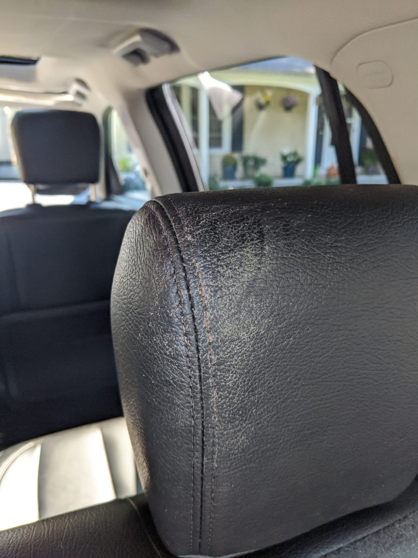 Dry dusty leather headrest with grey in the grain