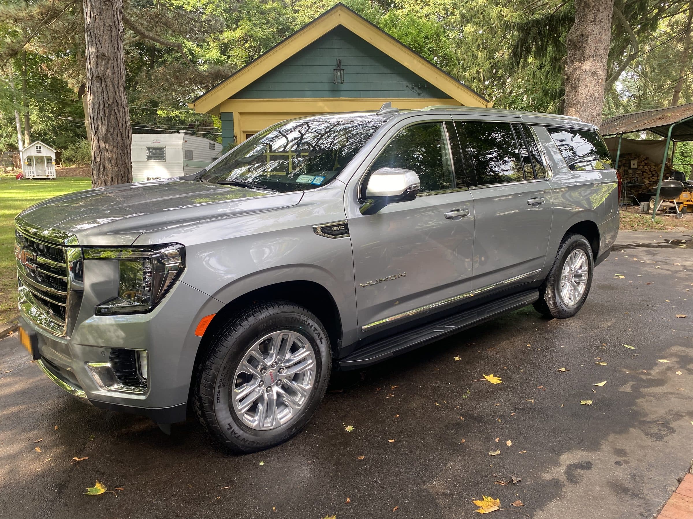Silver SUV detailed in a residential driveway
