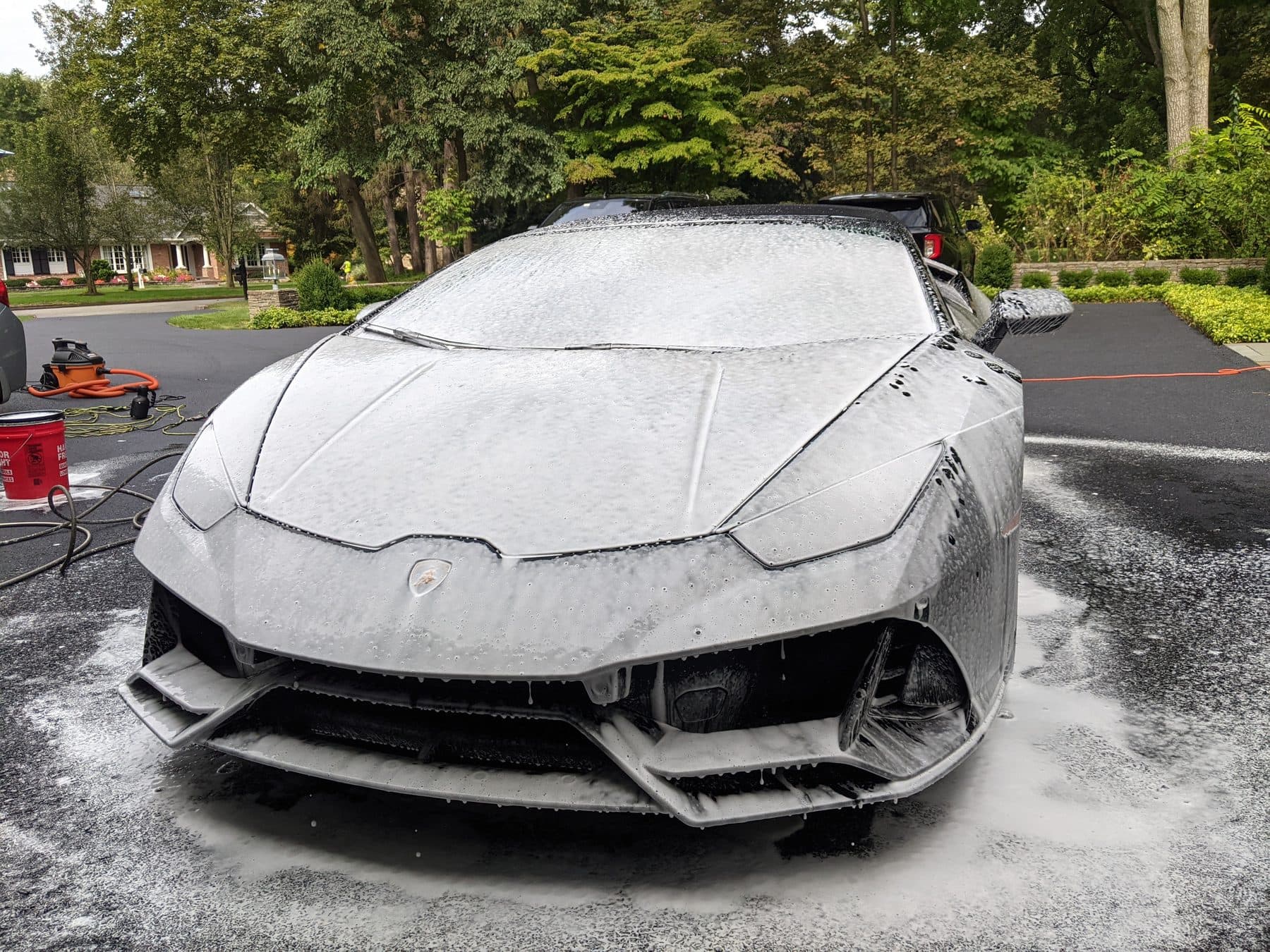 Front of a Lamborghini Huracan buried in snow foam