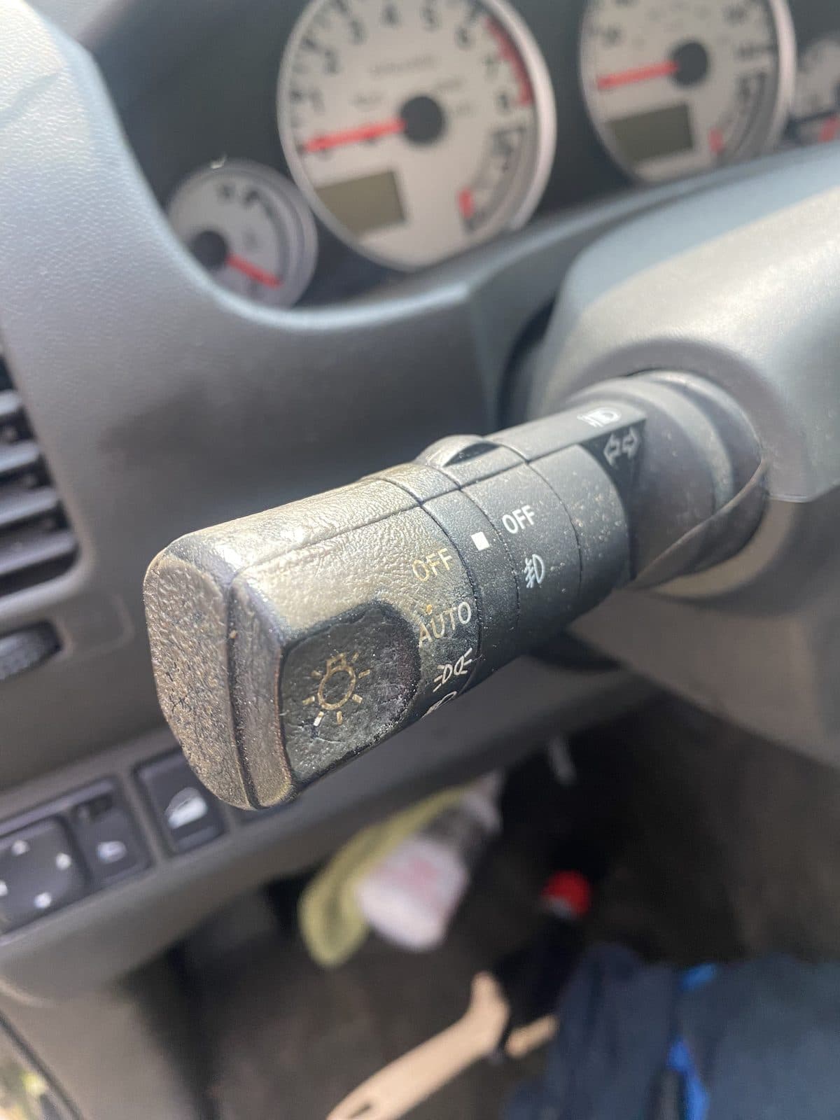 Dusty headlight stalk on a steering column